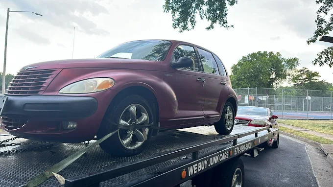 Chrysler PT Cruiser loaded on a flatbed for junk car removal in Springfield, VA